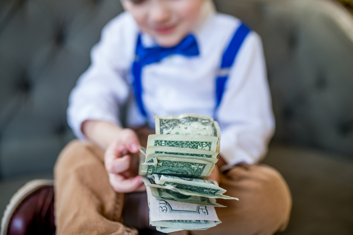 Michael Mooney helps out his parents by organizing their cash.