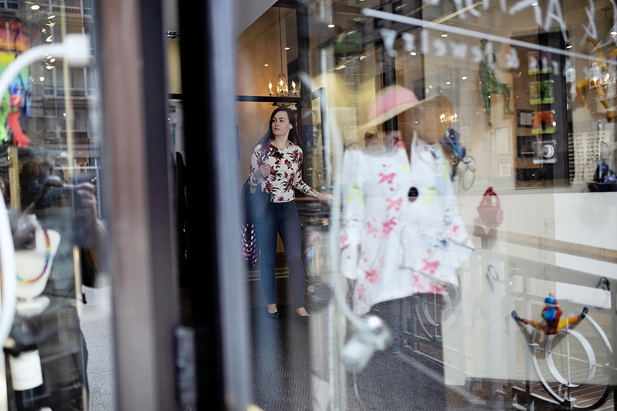 A woman does some shopping at a clothing store in Chicago, IL.