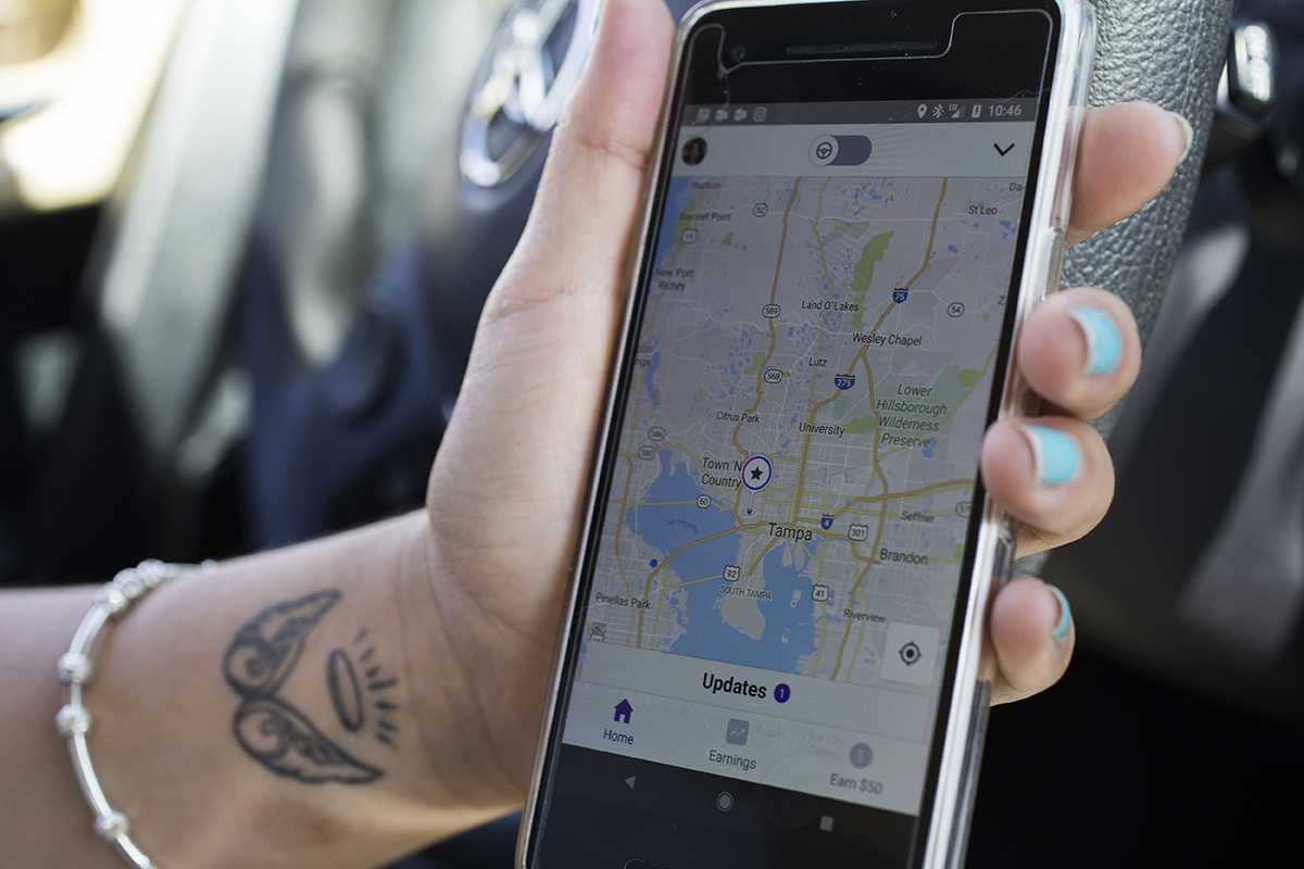 Girl holding phone using gps