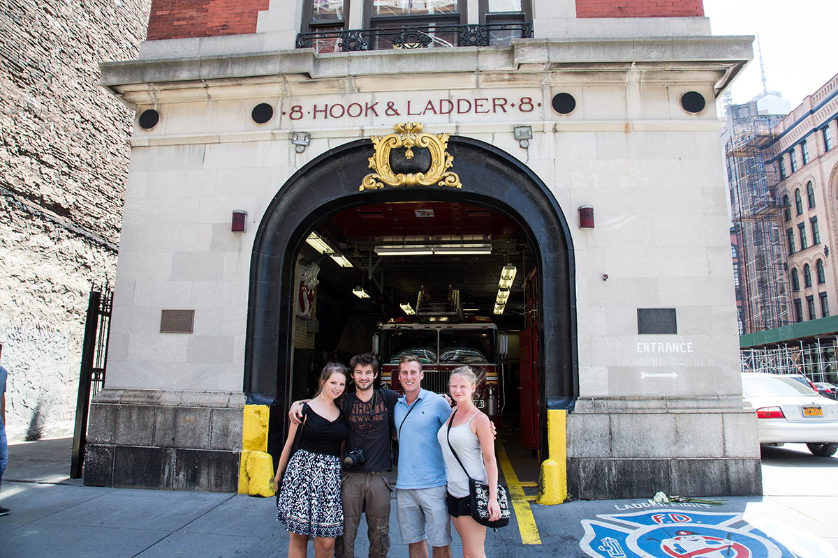 people on a tour outside a fire station