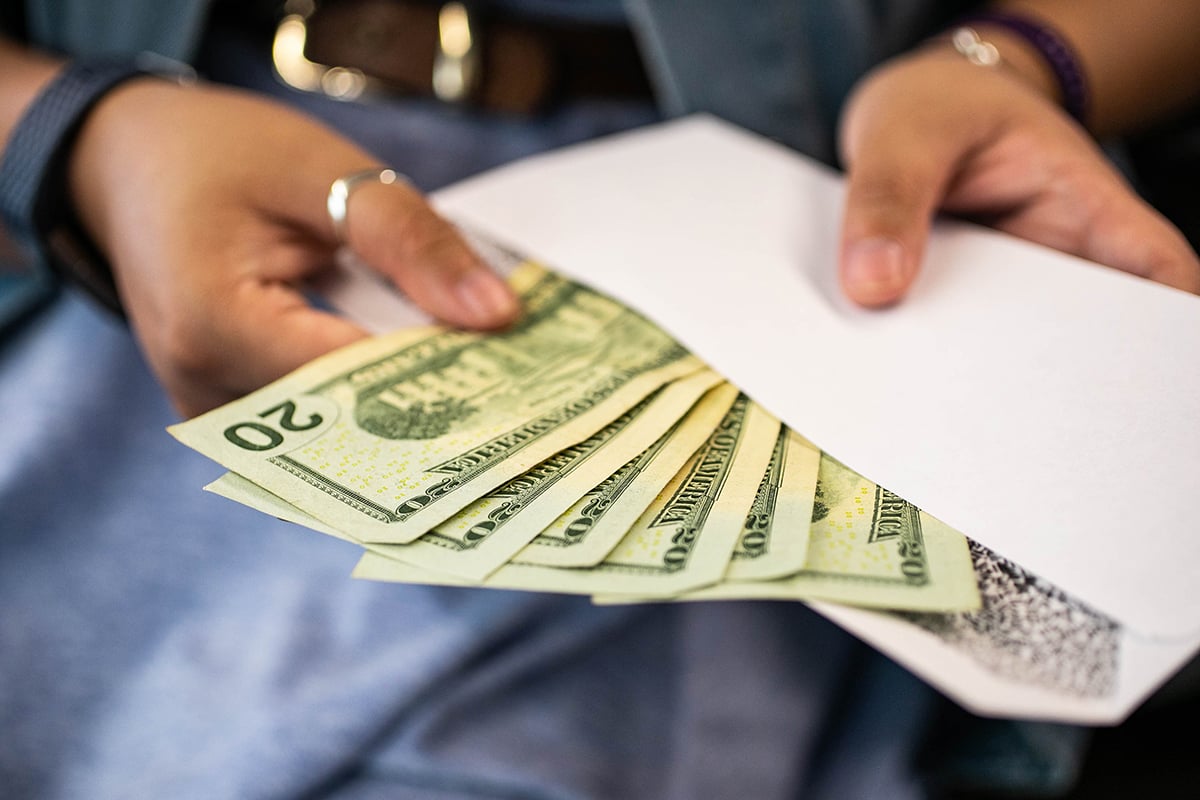 detail photo of money in a woman's hands