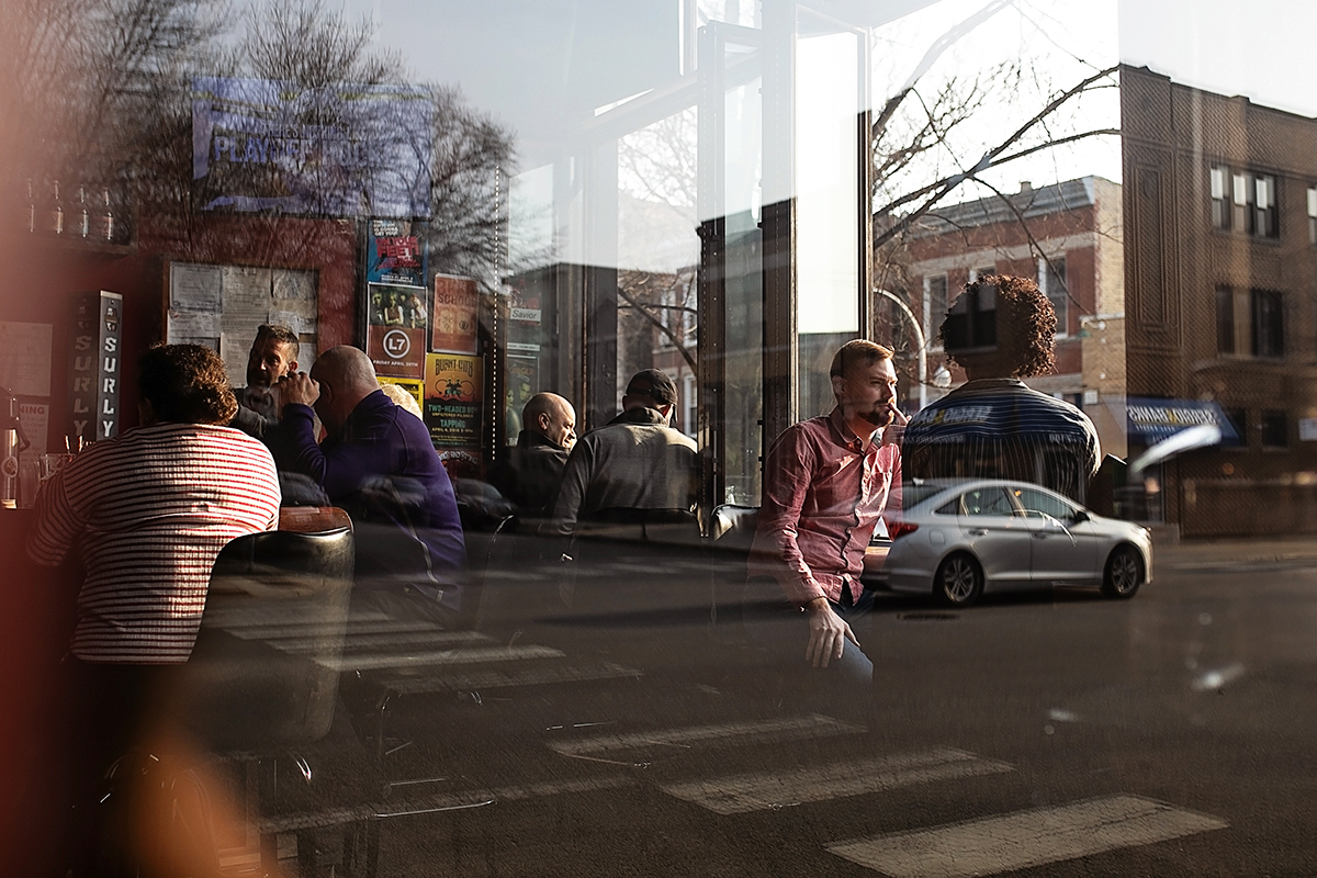 Patrick Grieve and his rented friend Lauren Little sit at the bar at Map Room in Chicago on April 13, 2018.