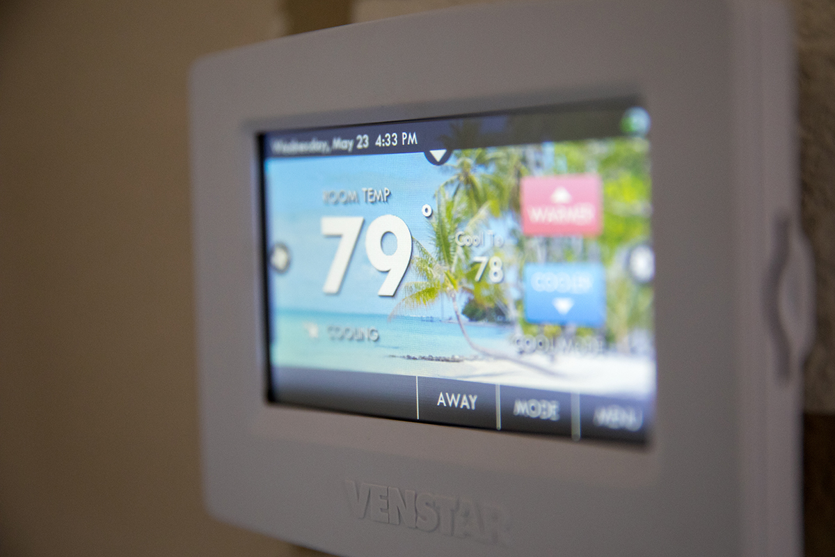 digital thermostat on a wall