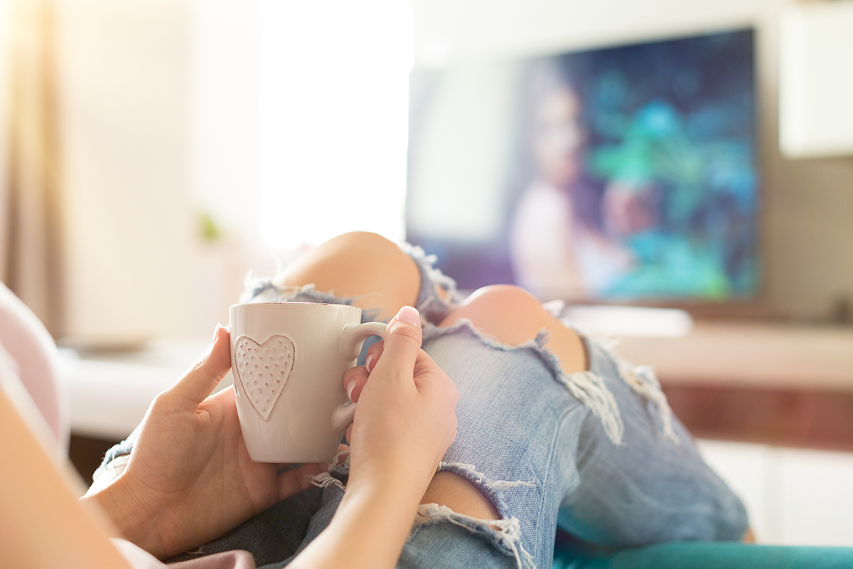 A woman relaxing with a cup of coffee