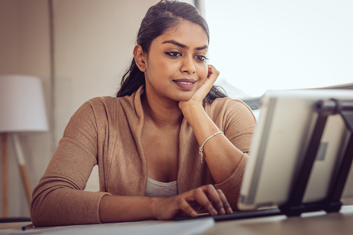 Woman browsing her laptop