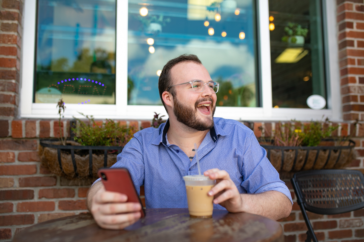 General shots of a man sitting at a coffee shop 