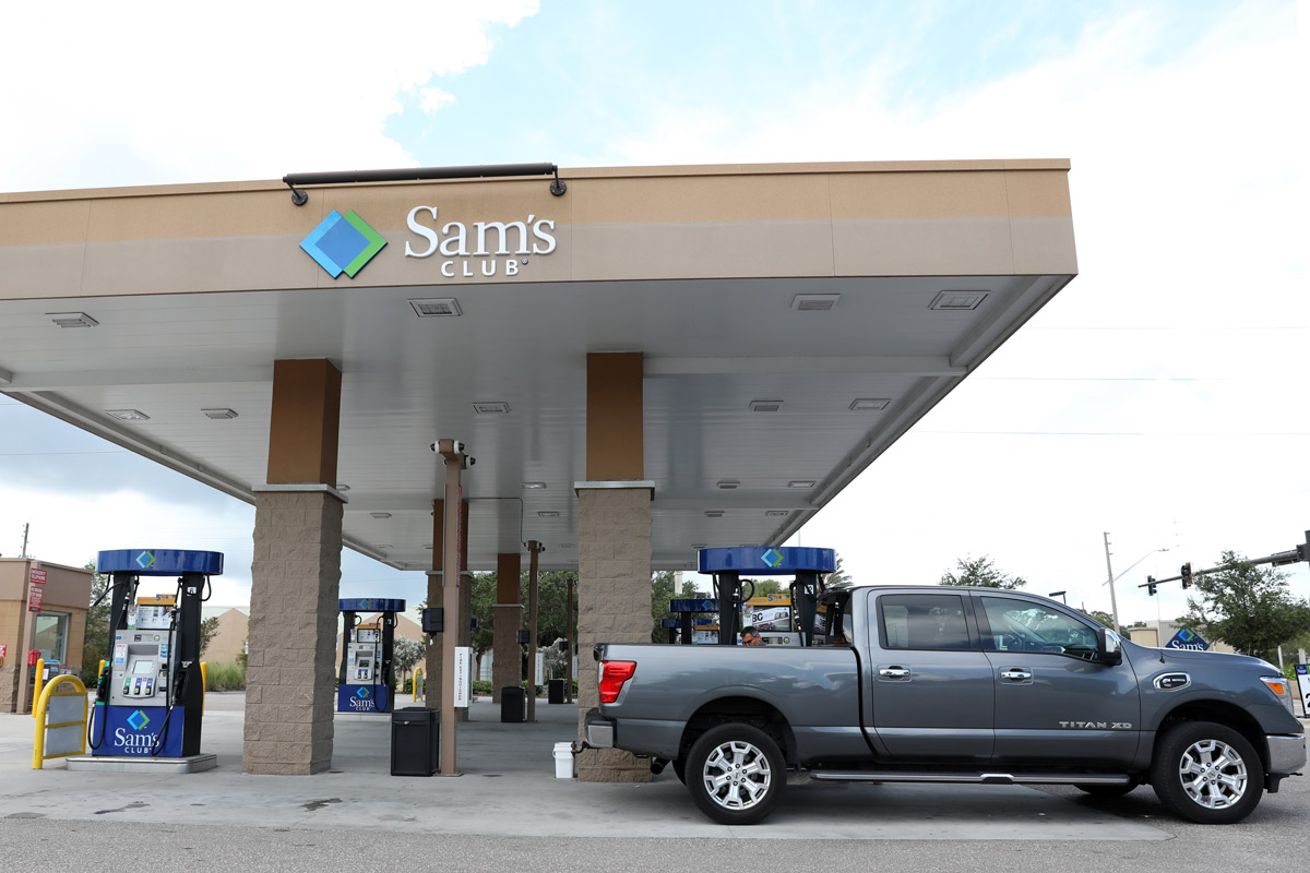 Someone puts fuel into their truck at the Sam's Club gas station. 