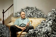 In this illustration, an elderly man sits on a couch with money surrounding him.