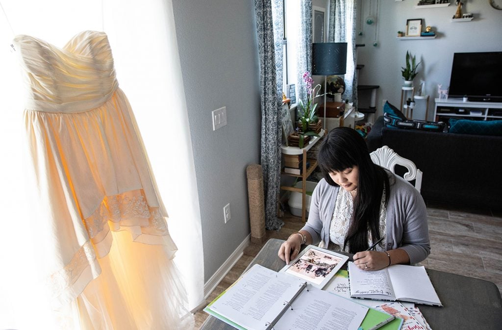 Couple reviewing wedding vendor costs and planning their wedding budget