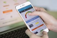 Dana Sitar with partner Stefan Davis spend some time reviewing credit sesame both on their phone and on personal laptop.