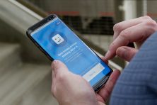 Lakewood, CO resident Linnea Nelson checks her Digit app on her phone Sunday, July 8, 2018 while walking around Union Station in Denver, Colorado.