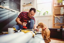 A man does a home improvement project at his house.