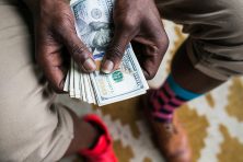 Albert Bell models opposing footwear in downtown Atlanta.