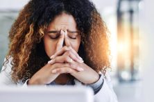 hot of a young businesswoman looking stressed out in an office