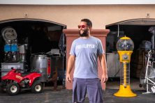 A man wears a t-shirt titled Pro Flipper