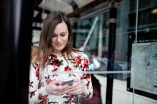 A girl checks her phone in Chicago.