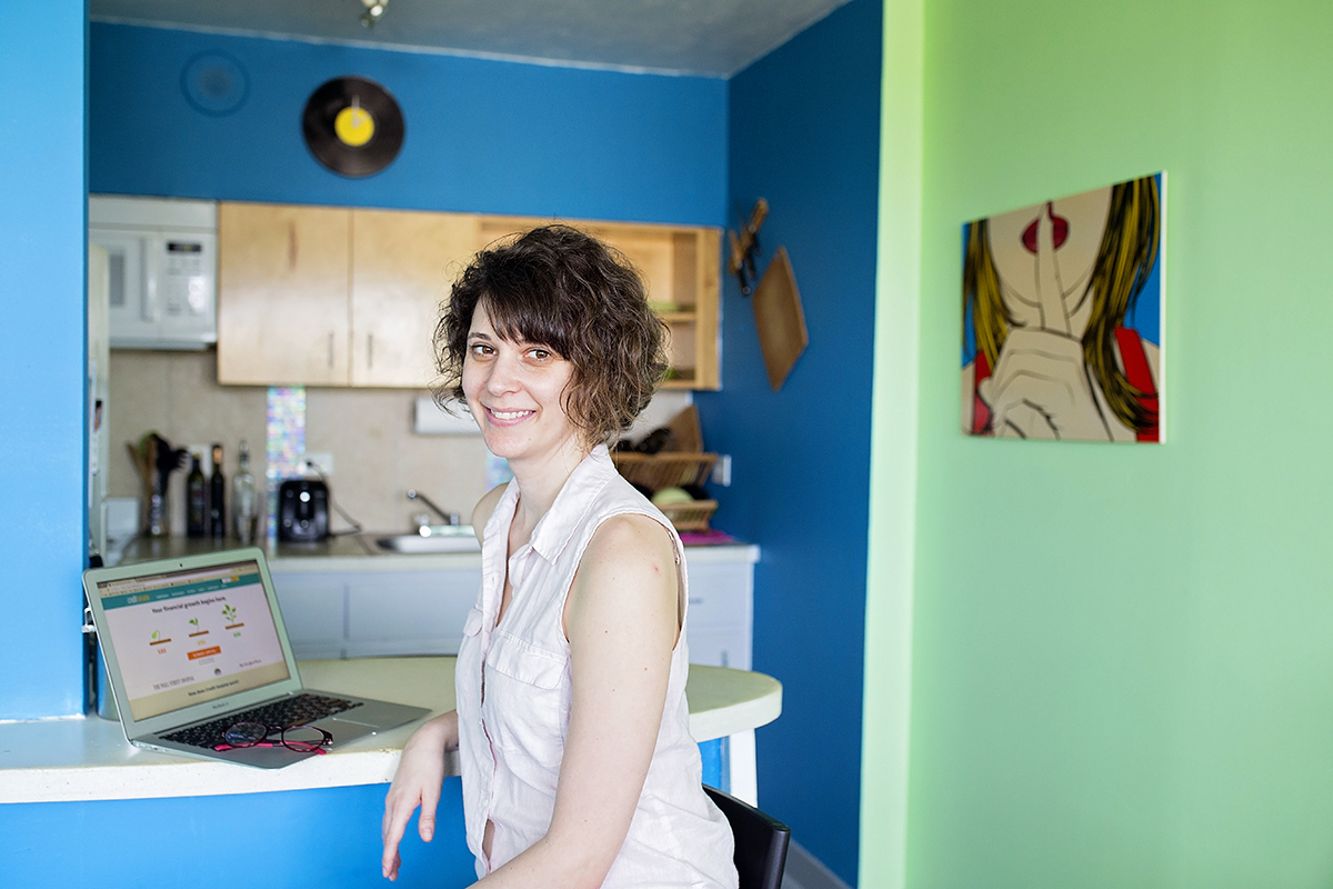 Dana Sitar, an editor and blogger, poses with her laptop in her apartment in St. Petersburg, Fla.