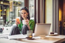 Young woman enjoying a cup of coffee on a rainy day