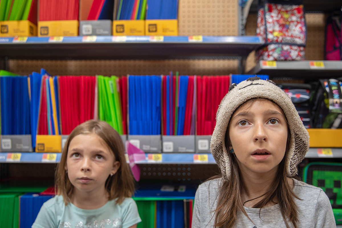 Twin sisters shop for school supplies