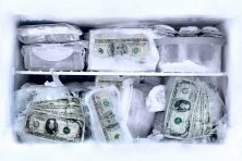 Money sits in a freezer.