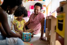 A mother, daughter and grandmother spend time together.