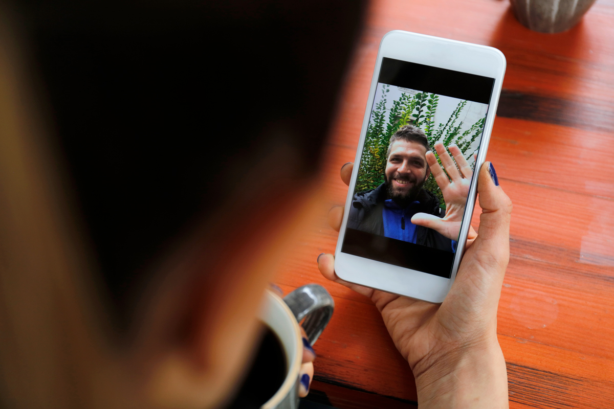 A woman FaceTimes with her boyfriend.