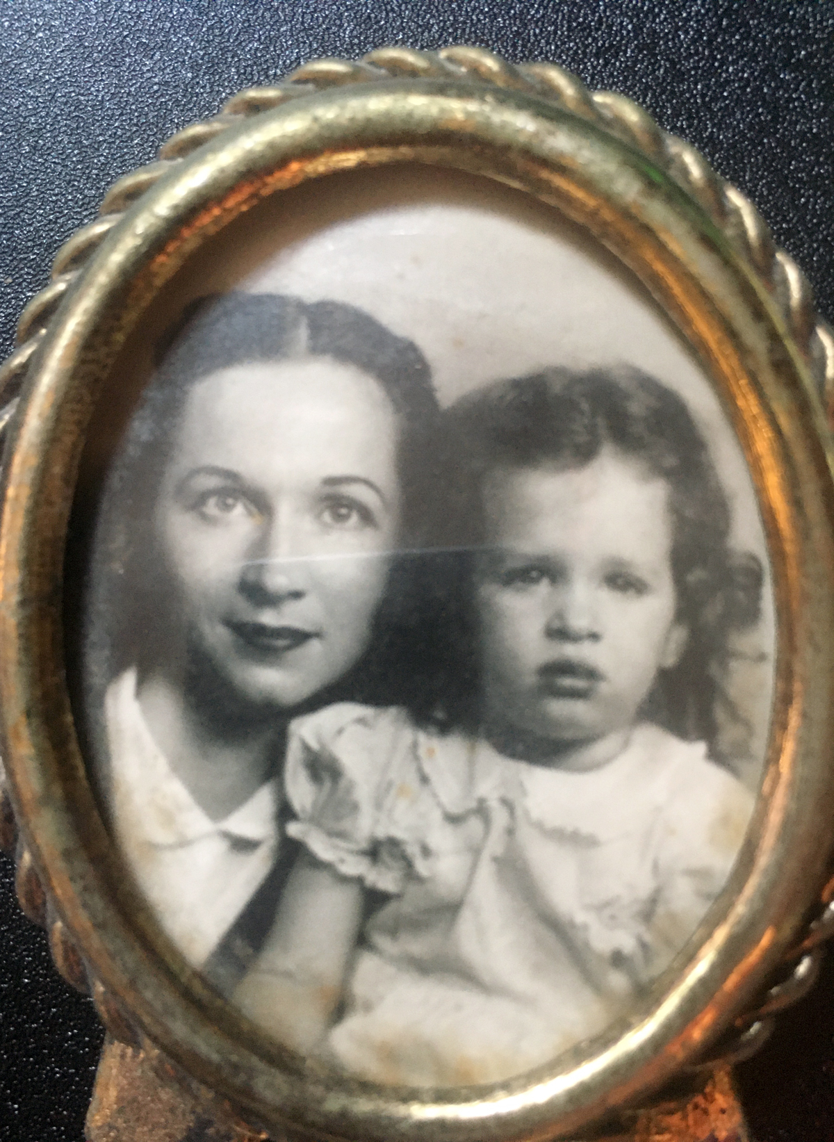 This old photograph is of a woman and her daughter, the woman who created the oven-fried chicken recipe. 