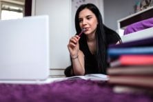 Person learning about personal finance and financial literacy concepts