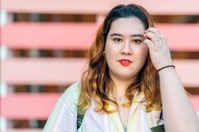 A woman started into the camera.