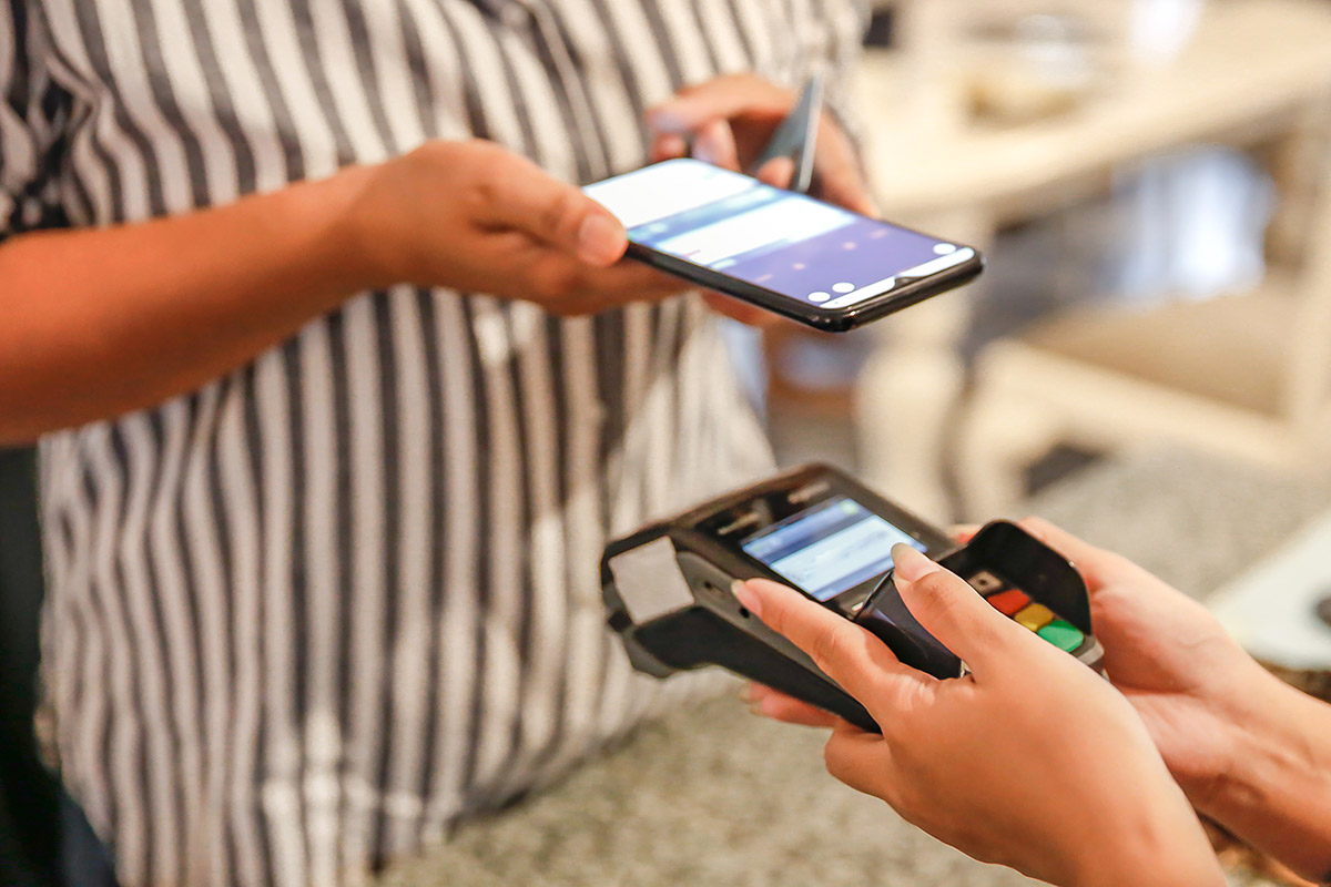 contactless payment at a restaurant using phone