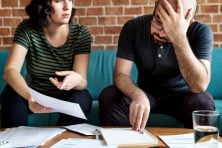 A couple stress over their finances.