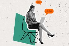 A woman works in an office chair.