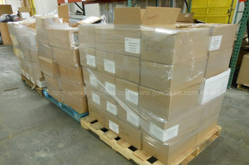 Hundreds of math books sit in boxes. 