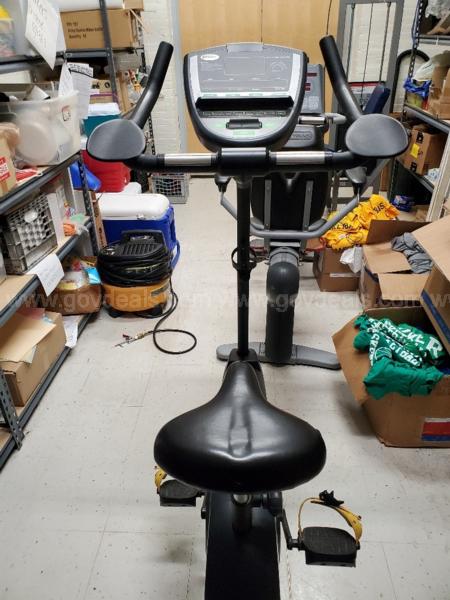 A fitness bike sits in a warehouse. 