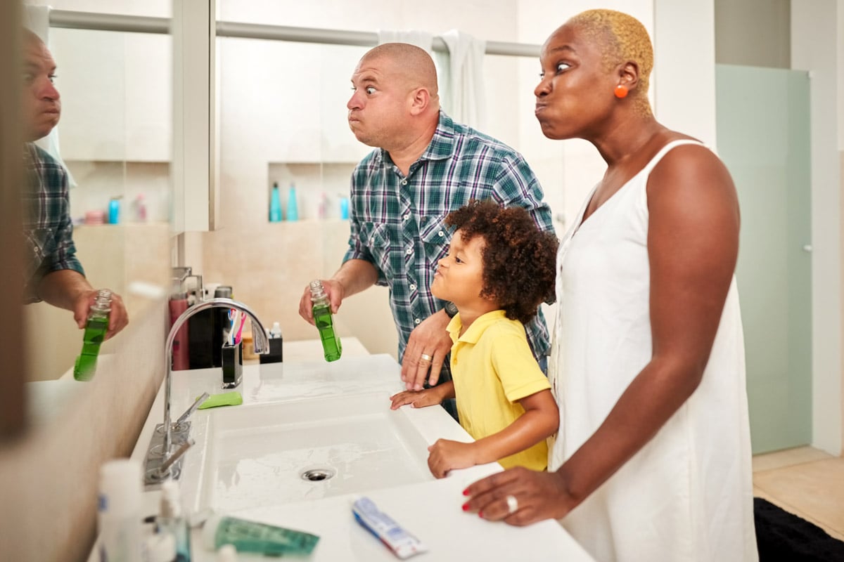 A family brushes their teeth.