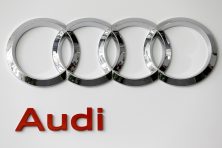 A photo shows the Audi and Volkswagen logos.