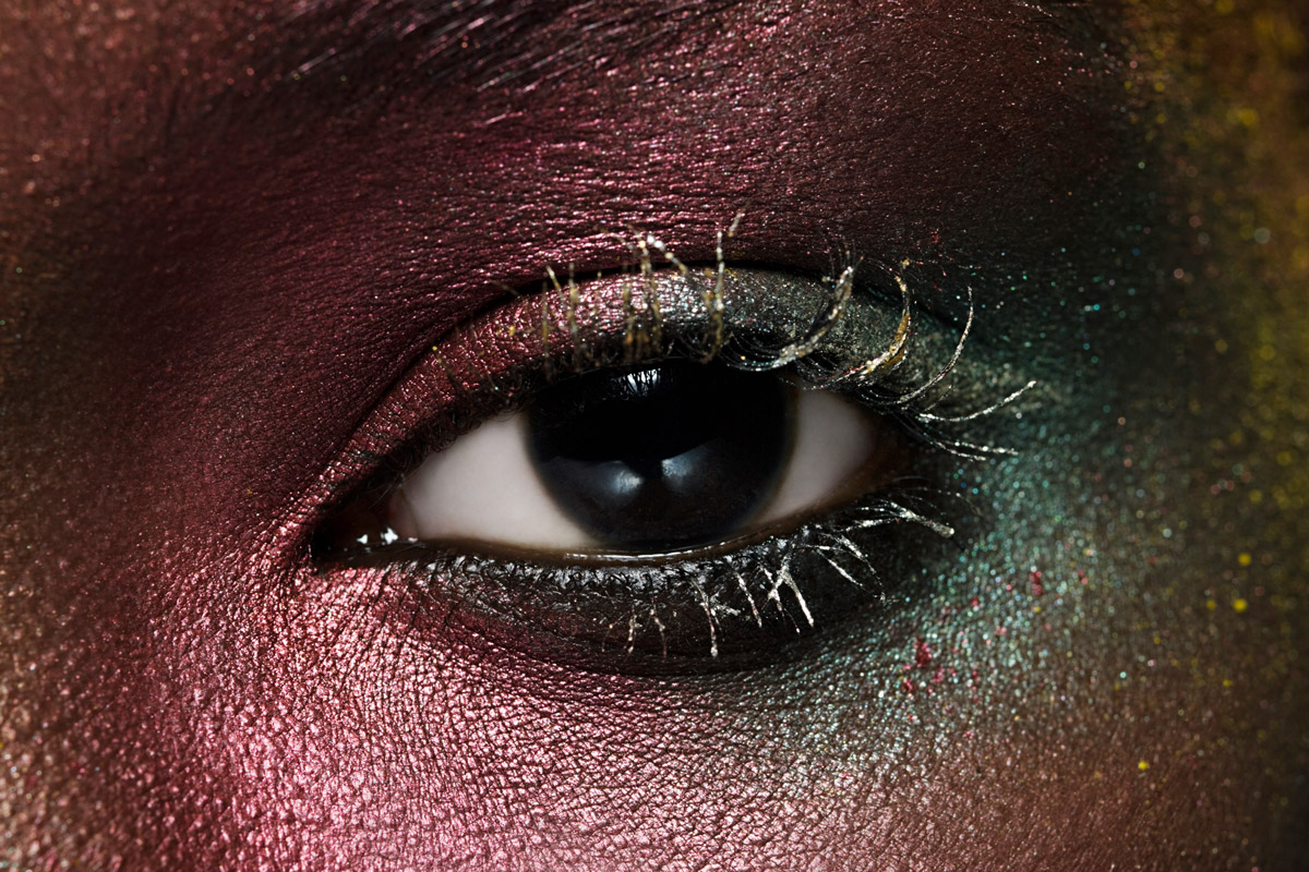 A person wears eye shadow.