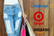 A woman holds a shopping bag with logos for Walmart, Target and Amazon beside her.