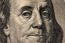 A photo of Benjamin Franklin is shown on the $100 bill.