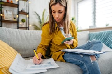 Person completing their monthly zero-based budget using EveryDollar app