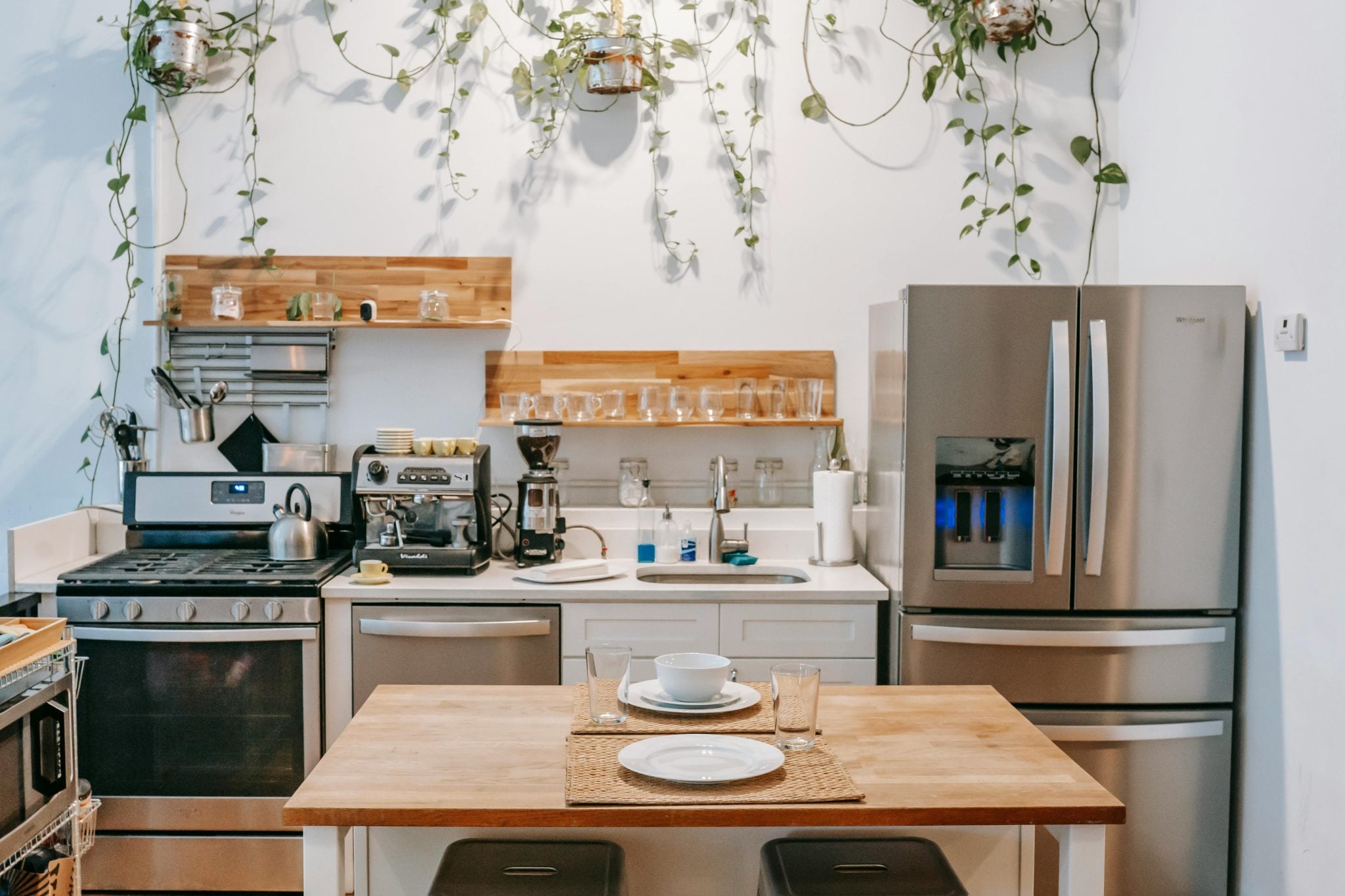 A photo of a kitchen shows the oven and refrigerator. 