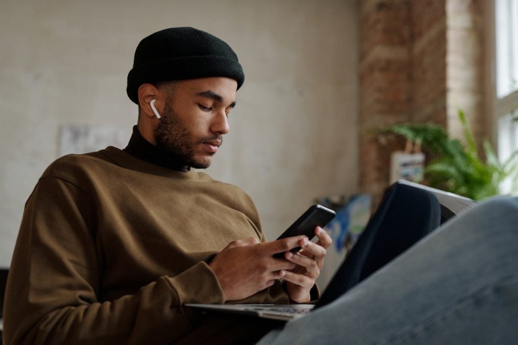 Person reviewing their financial progress using Monarch Money budgeting app