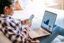 Person reviewing their investment portfolio and budget using Empower app