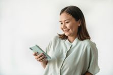 Person using Copilot Money budgeting app on iPhone