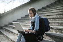 College student reviewing their semester budget on a laptop