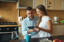 Couple reviewing their wedding budget and planning expenses