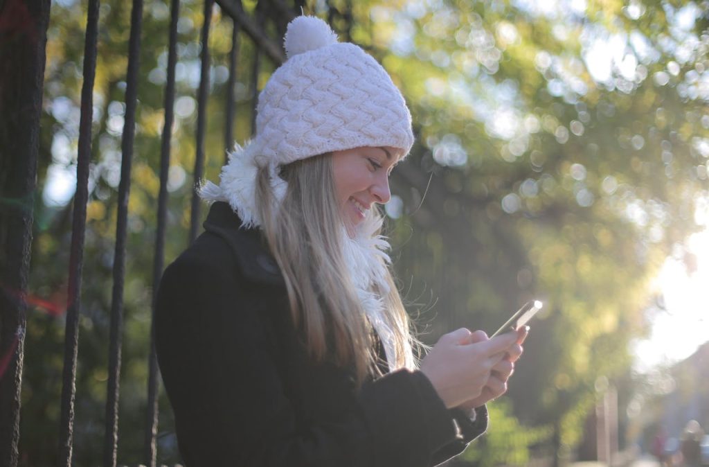 Person reviewing their budget using Copilot Money app on iPhone