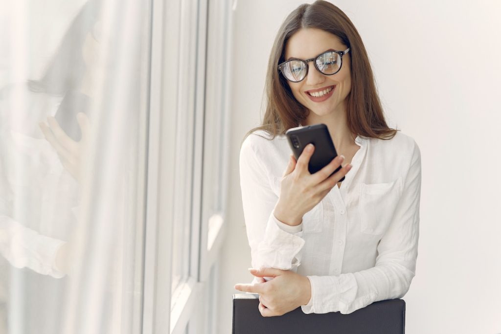 Person checking their available spending budget using a budgeting app