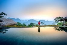 Someone takes photos of a view on vacation