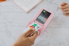 Someone uses their credit card to buy something.